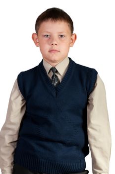 Schoolboy. Isolated over white background. The boy is dressed in a vest.