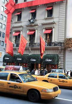 People looking for gifts at Cartier jewels boutique during Christmas holidays.