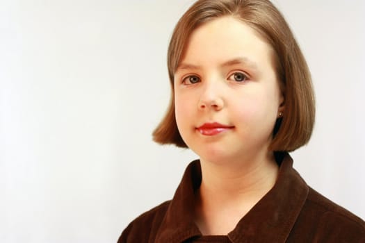 Pretty young girl with short brown hair.