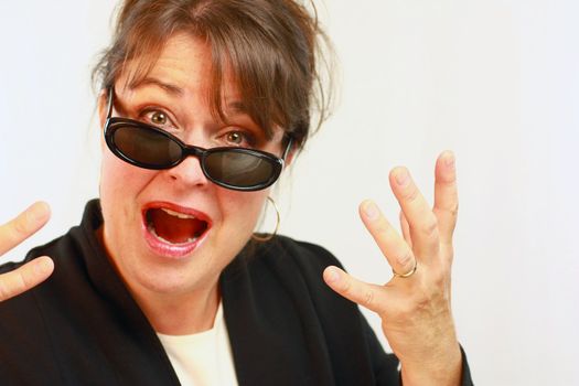 Brunette haired woman expressing  frustration with hands.