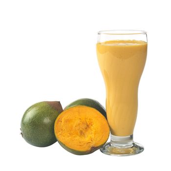 Milkshake out of the Peruvian fruit called Lucuma (lat. Pouteria lucuma) grown in the Andean region of Peru, which is very popular in Peru (Isolated on White) (Selective Focus, Focus on the front)