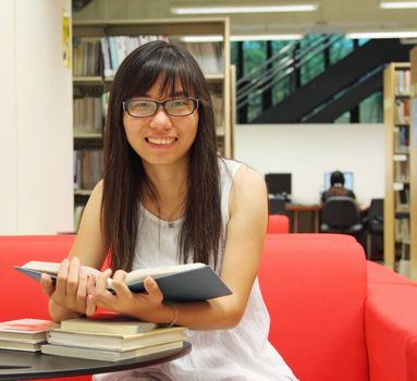 Asian girl student in library