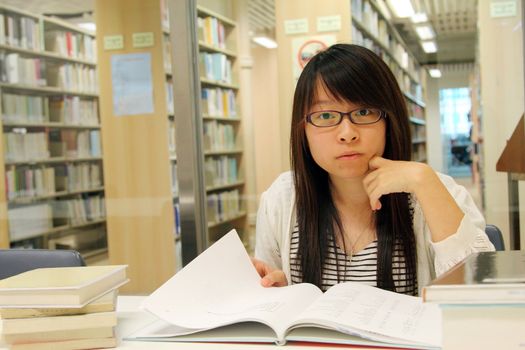 Asian girl student in library