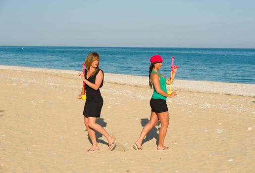 Girls with waterguns about to start a  soaking duel