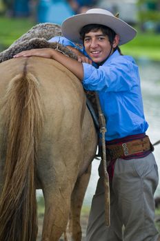 TACUAREMBO, URUGUAY - MAR 5 : Participant in the annual festival "Patria Gaucha" on March 5, 2011 in Tacuarembo, Uruguay. It is one of the biggest festival in South America to celebrate gaucho culture