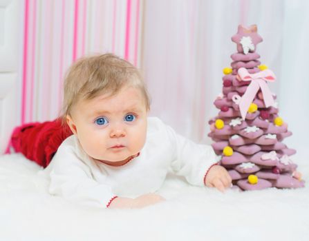 Christmas theme: clouseup portrait baby girl with decorate christmas tree