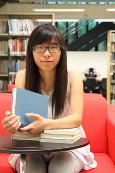 Asian girl student in library