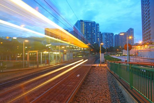 Traffic in Hong Kong at night. Light rail.