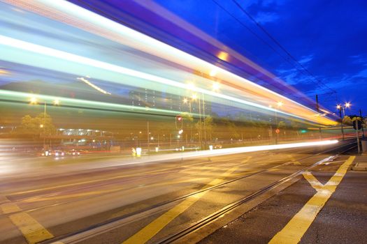 Traffic in Hong Kong at night. Light rail.