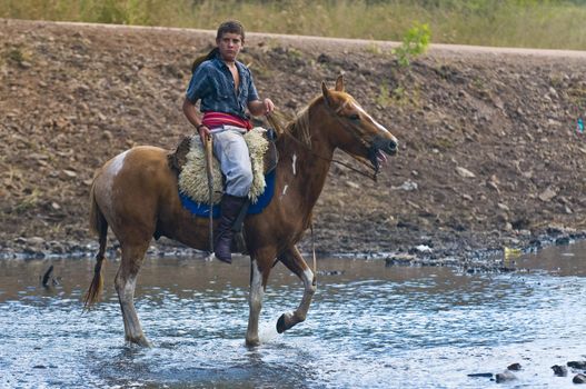 TACUAREMBO, URUGUAY - MAR 5 : Participant in the annual festival "Patria Gaucha" on March 5, 2011 in Tacuarembo, Uruguay. It is one of the biggest festival in South America to celebrate gaucho culture