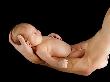 Father holding newborn baby. Portrait of a newborn boy closeup