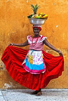 CARTAGENA DE INDIAS , COLOMBIA - DEC 21:Unidentified Palenquera woman sell fruts in Cartagena de Indias on December 21 2010,Palenqueras are  a unique African descendat ethnic group found in the north region of South America