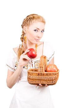 Redheaded woman with basket of apples over white