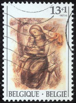 BELGIUM - CIRCA 1987: A greeting Christmas stamp printed in Belgium shows Madonna and Child