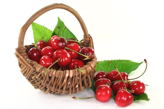 a basket filled with fresh red cherries

