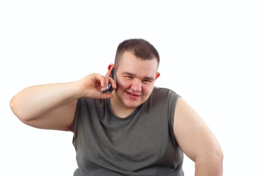 the large man speaks through mobile phone