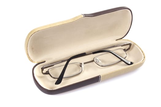 Glasses in spectacle case on white background