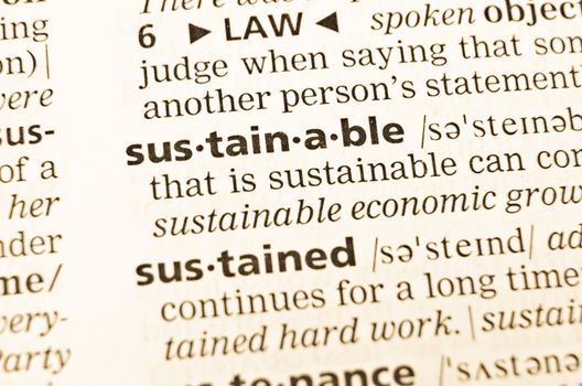 The word sustainable in the old dictionary. Selective focus effect.