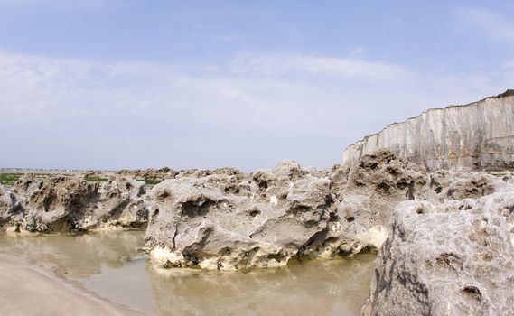 Chalk cliff along the beach in Normandie in France