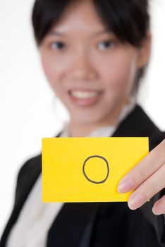 Right symbol on business card holding by Asian businesswoman.
