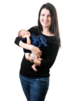 A newborn infant being held in the arms of her smiling mother isolated over a white background.