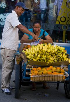 CARTAGENA DE INDIAS , COLOMBIA - DEC 18 :Unidentified colombian woman sell fruits in the street in Cartagena de Indias on December 18 2010