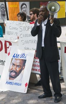 NEW YORK -  JUNE 27 2011 : Unitentified participants in a demonstration against the government of Sudan in front of the UN offices in New York city on June 27 2011