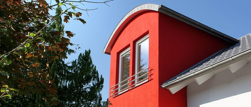detail of a house with modern red dormer