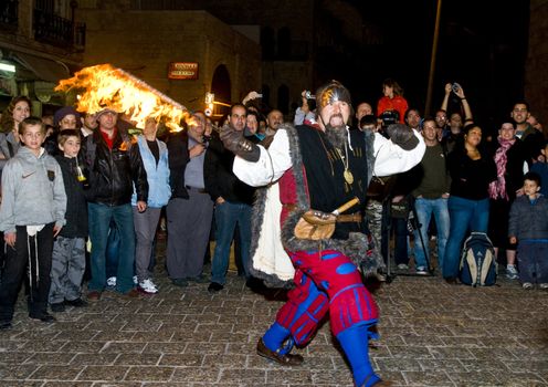 JERUSALEM - NOV 03 : An Italian actor dresses as knight fight with sword and fire in the annual medieval style knight festival held in the old city of Jerusalem on November 03 2011