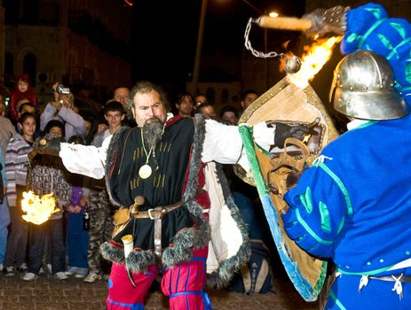 JERUSALEM - NOV 03 : An Italian actors dresses as knight fight with sword and fire in the annual medieval style knight festival held in the old city of Jerusalem on November 03 2011