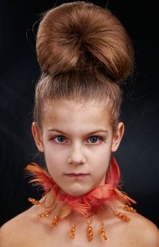 Portrait of elegant girl with make-up on the face. In studio on black background