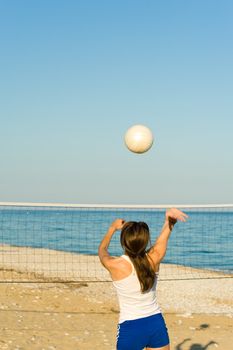 Volleyball match on a sunny Mediterranean beach