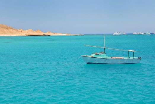boats on turquoise water of Red Sea, Egypt