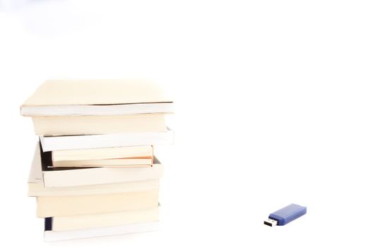 Concept of memories: blue usb key close to books