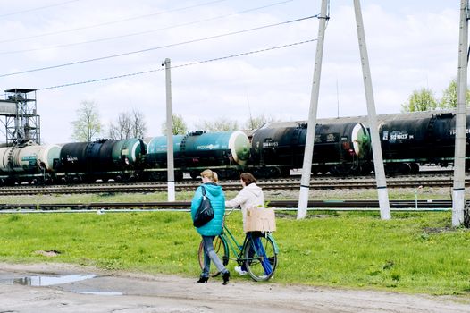 Two people wallking  near the railway, taken in Russin province on May 2011.