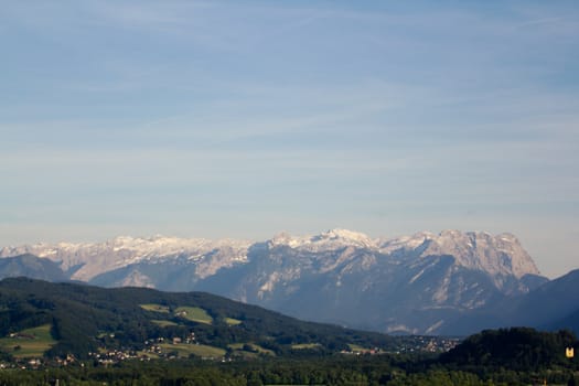 The Alpine mountains of Austria below the warm sun of summer