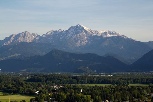 The Alpine mountains of Austria below the warm sun of summer