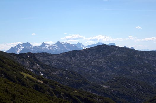 The Alpine mountains of Austria below the warm sun of summer