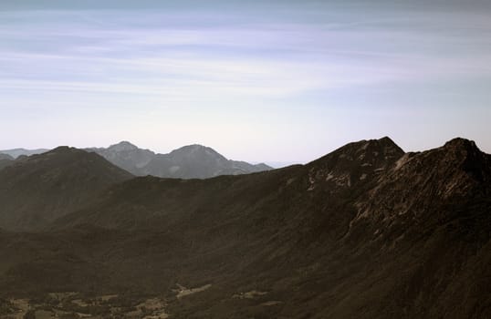 The Alpine mountains of Austria below the warm sun of summer