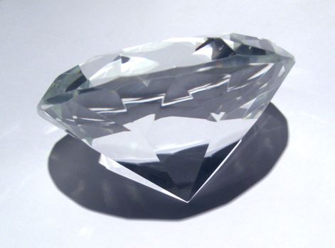 diamond on white, symbol for imperishability, luxury an financial stability