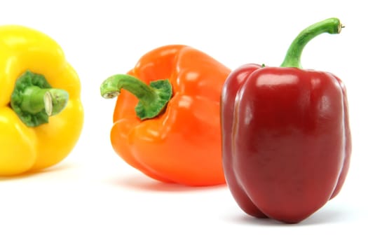 clor peppers focus on red one closeup isolated on white background food and vegetables concepts
