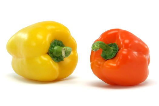 yellow and orange color  peppe closeup isolated on white background food and vegetables concepts