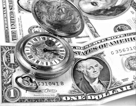 money-time.Pocket watch and dollars