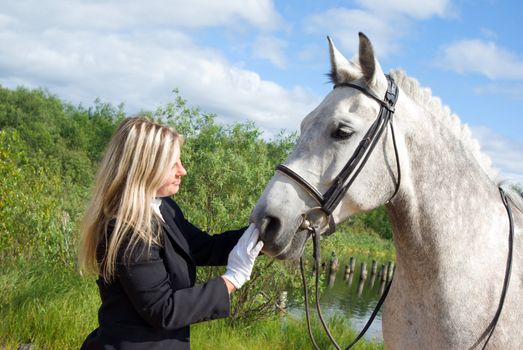 girl with horse.Friendship of an animal and the person