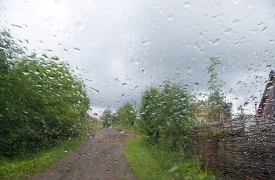 Raindrops.Car glass.rural terrain.