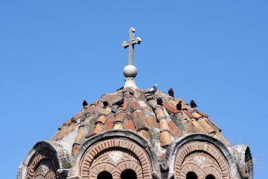 byzantine orthodox church dome detail with pigeons on at athens greece