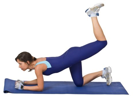 Young brunette doing aerobics on a blue mat.Shot with Canon 70-200mm f/2.8L IS USM