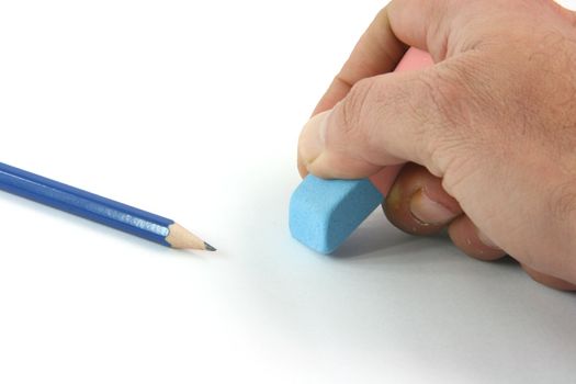 business concepts closeup  erasing mistakes and black pencil isolated on white background