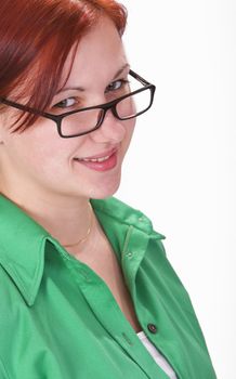 Portrait of a redheaded girl student with glasses.