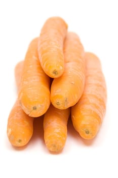 Bunch of carrots. White background. Shallow depth of field.